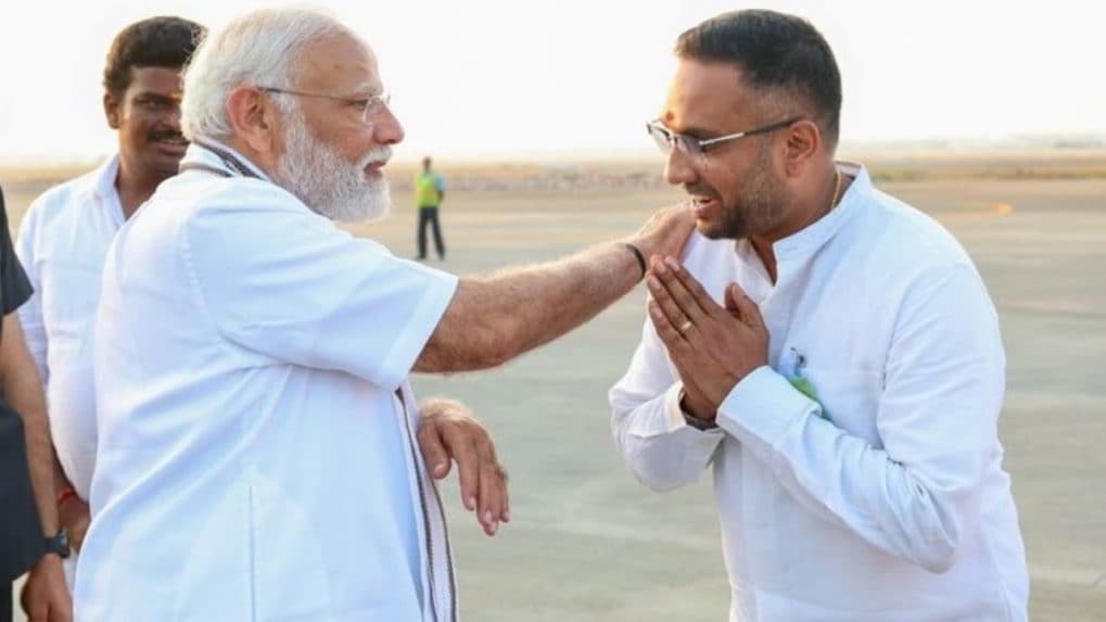 PM Narendra Modi interacts with BJP worker, who missed meeting newborn twins to welcome him at airport [Video]