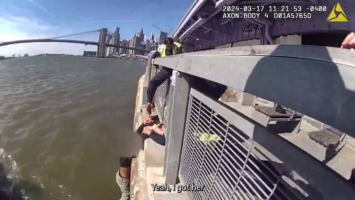 Woman attempting to jump into East River grabbed by NYPD officers | News [Video]