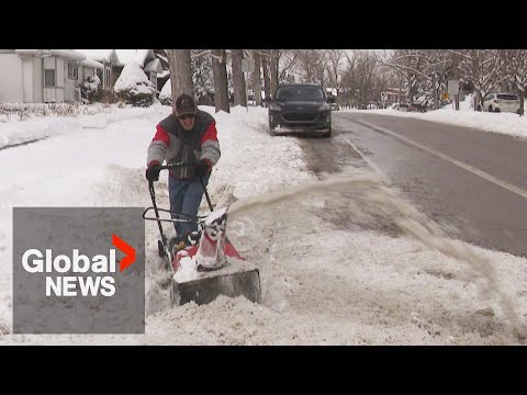 Calgarians dig out after spring storm brings over 20 cm of snow [Video]