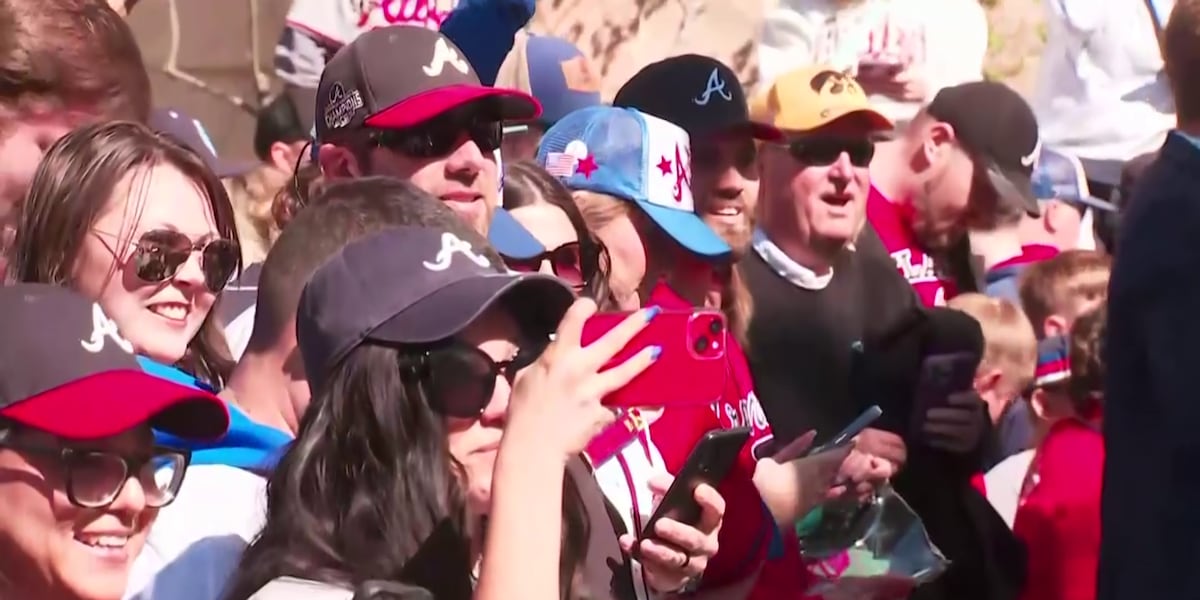 Fans line the streets of the Battery [Video]