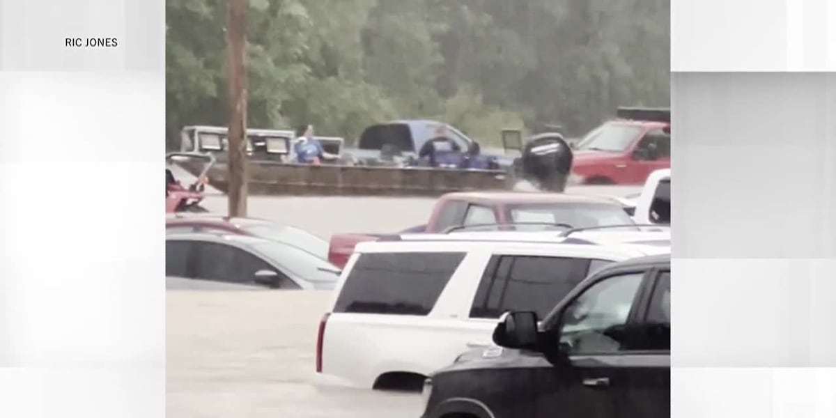 Woman rescued by boat after flash flooding inundates her workplace [Video]